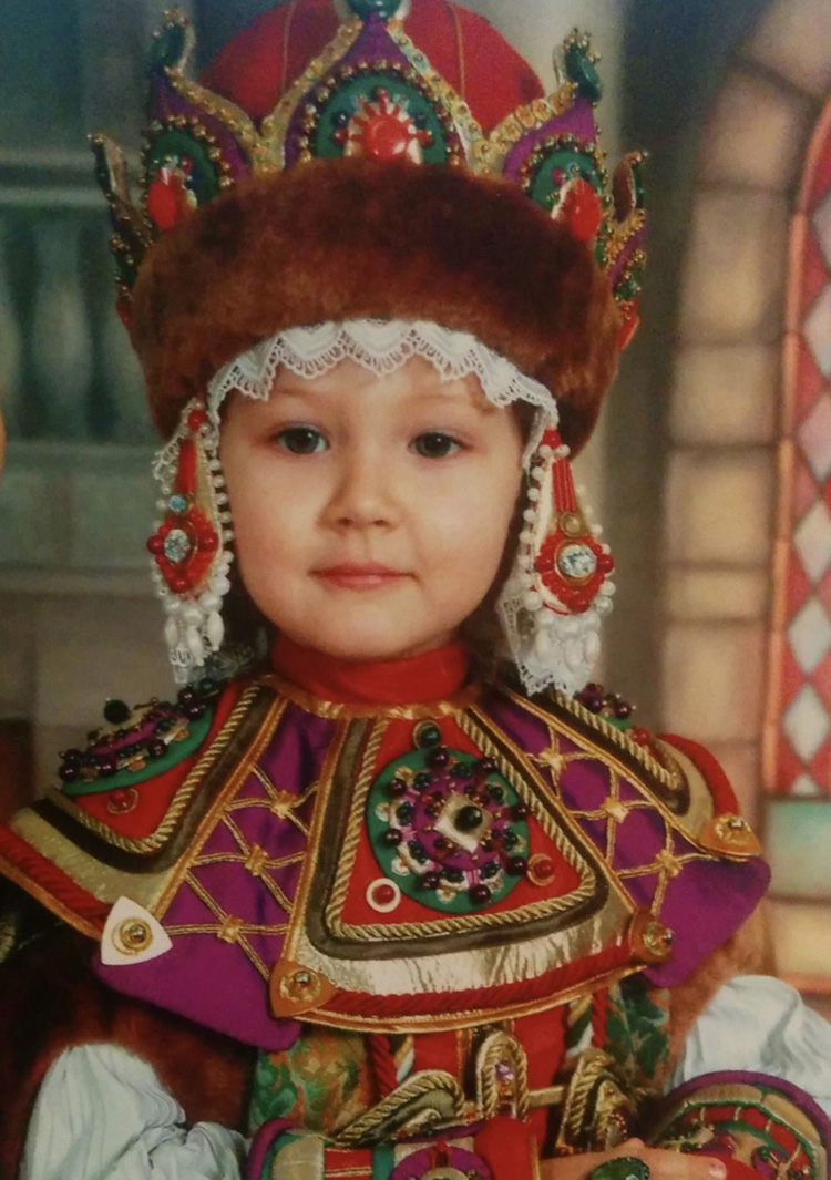 Childhood photo of Sofia Liashcheva wearing a traditional Russian gown.