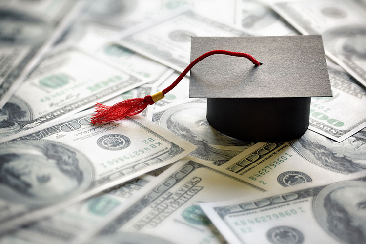 photo illustration of a mortar board and US currency