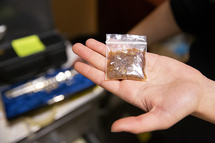 A small plastic bag contains shellac that's used by the Cal Band to melt into adhesive to repair pads on the instruments.
