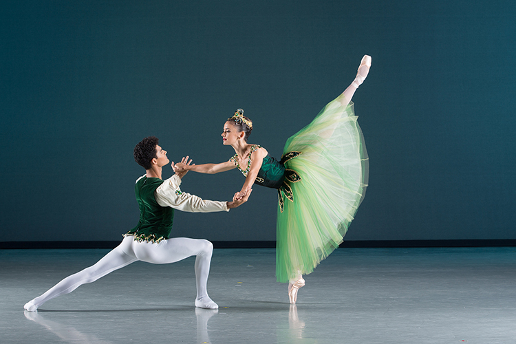 two ballet dancers perform on stage