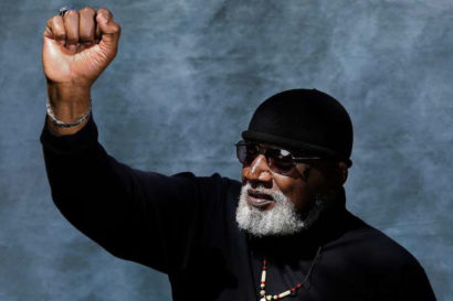 a person holds their fist in the air