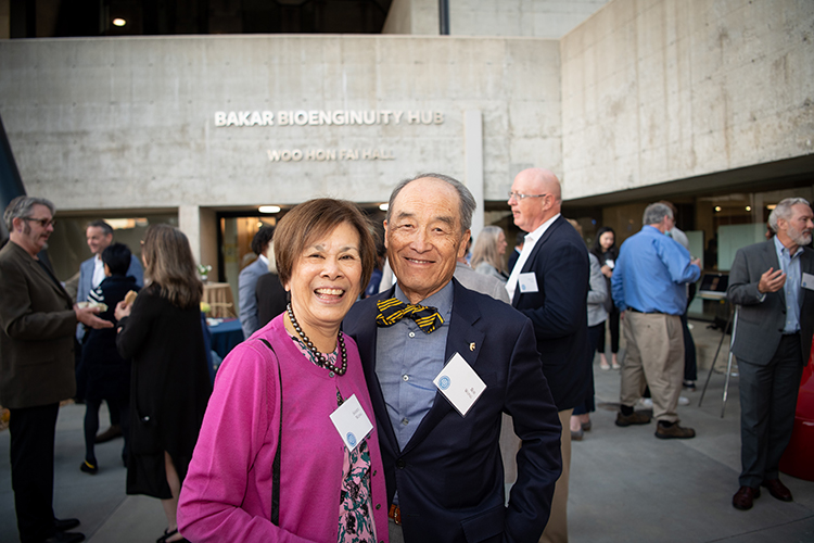 Sheryl and Bob Wong smiling outside of the building.
