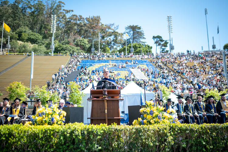 a person speaks at the podium