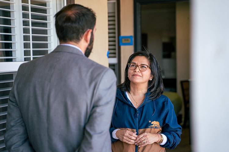 A state official, Lourdes Castro Ramírez, talks with the assistant to the city manager of Berkeley, at the Rodeway Inn on University Avenue, where people who have been living in People's Park are moving as part of a town/gown program.