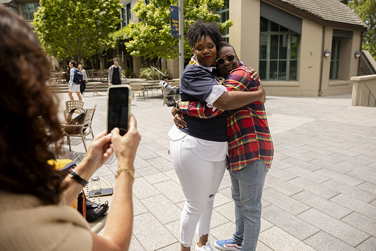 Ockemia Bean hugging Geremy Lowe.