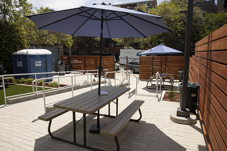 Shaded picnic tables and clean outdoor toilets are just some of the amenities available at the newly opened Sacred Rest Drop-In Center in Berkeley, Calif. on Wednesday, June 22, 2022.