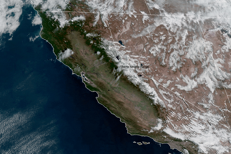 A satellite image shows the state of California from above, with minimal cloud cover and some white snow over the Sierra Nevada mountains.