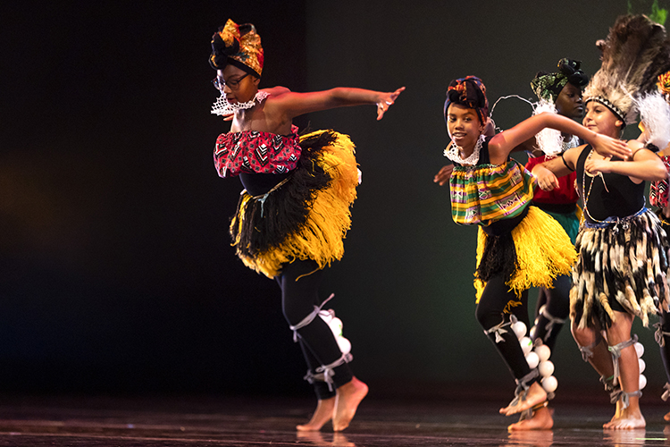 dancers in African clothing on stage