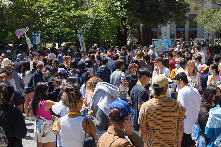 A crowd of students at Golden Bear Orientation congregates in summer 2022.