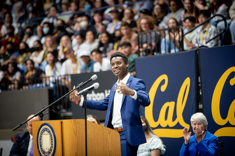 ASUC President Chaka Tellum addresses students at a podium at fall convocation 2022.