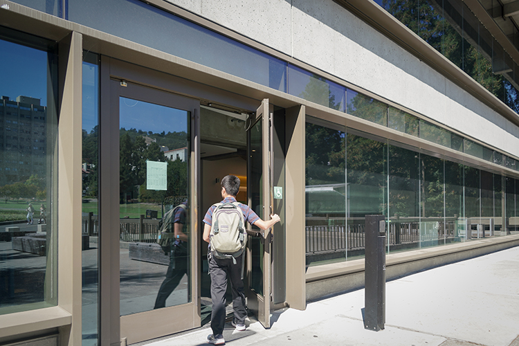 A student enters the front doors of Moffitt Library on Aug. 22, 2022, when it reopened following months of seismic reinforcement.