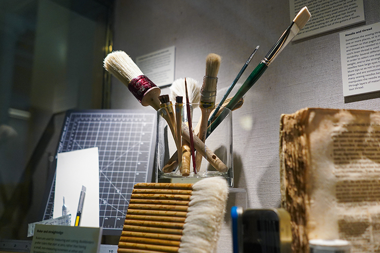 brushes and old books on display