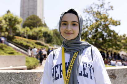 a person smiles at the camera