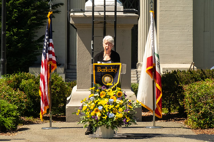 Chancellor Carol Christ stands at a podium that says Berkeley