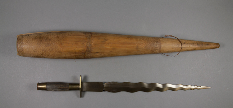 Knife with a wavy blade and a sheath.