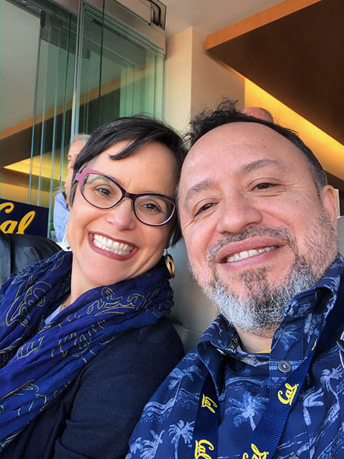 García Bedolla smiles sitting next to her husband