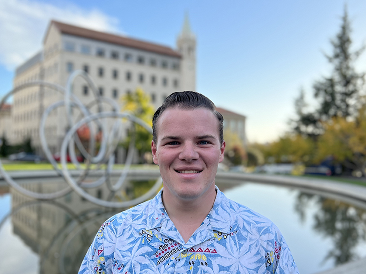Student Matthew Rowe, a philosophy major who changed his major from political science thinking the change will best prepare him to address climate change after he graduates, poses for a close-up near the Hearst Memorial Mining Circle.