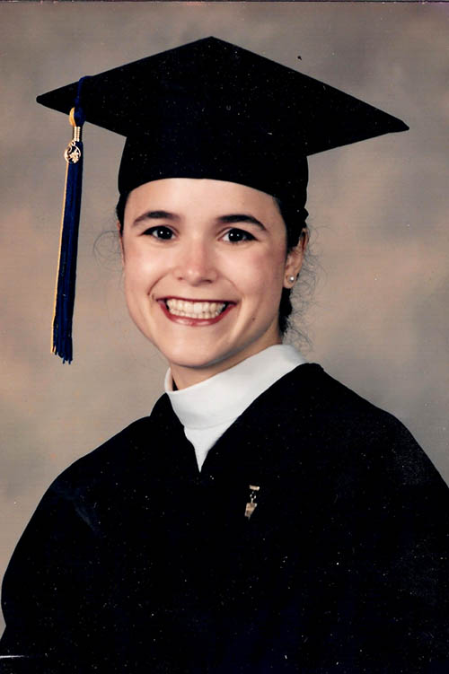 García Bedolla in a grad cap smiling