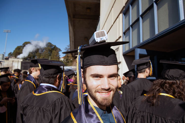 a student with a bart train on their cap