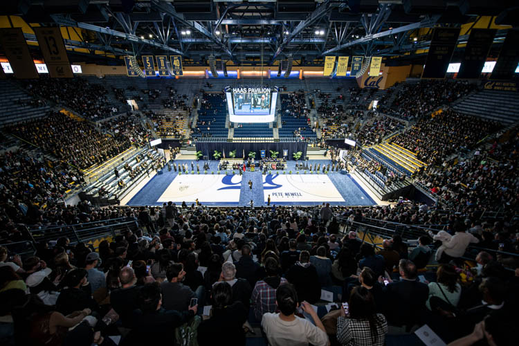 a wide-angle shot of a crowded basketball arena