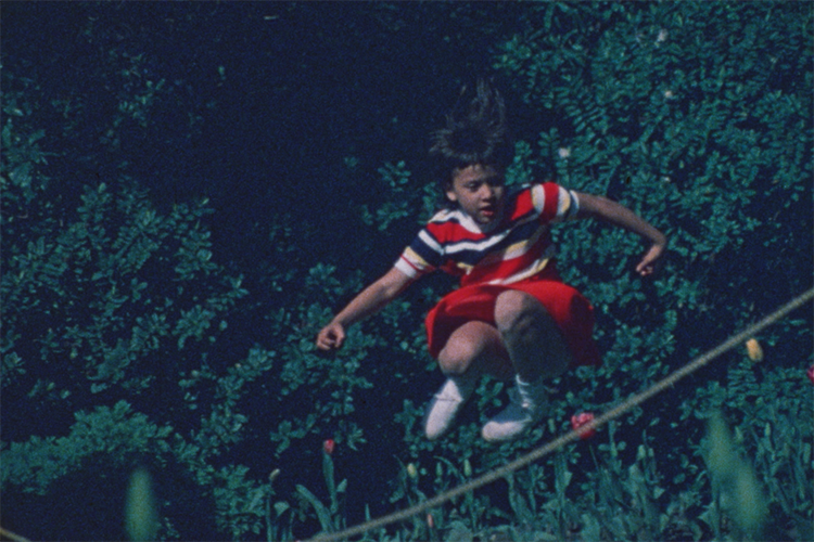 A girl jumps rope in this image taken from a home movie called 
