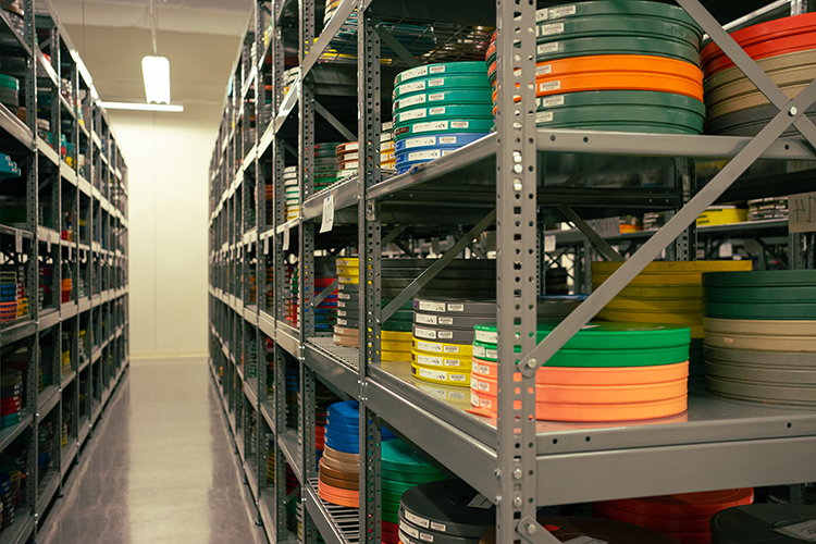 Reels stored in colorful film cans at the BAMPFA film vault are for films from the 1960s and '70s, a more vibrant time.