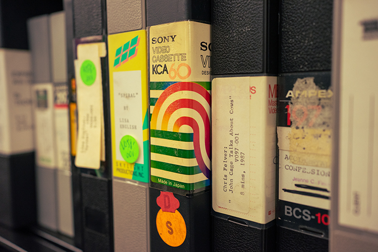 Video cassettes on shelving at the PFA's Richmond Field Station vault contain interviews with filmmakers who visited the archive.