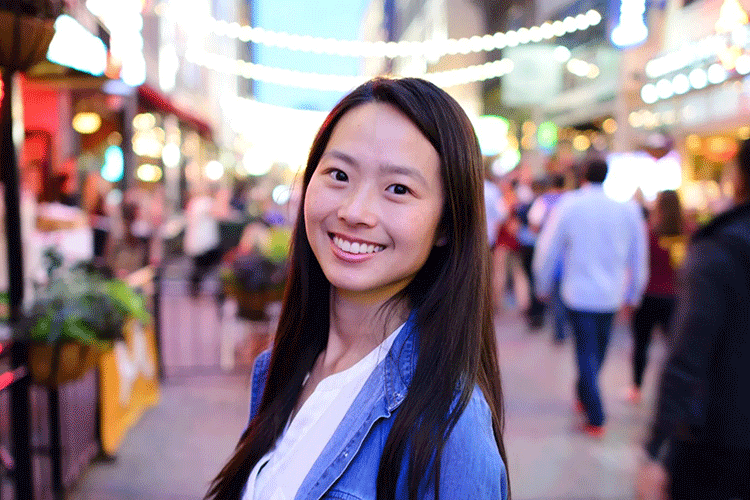 A portrait of Grace Gu in an urban environment