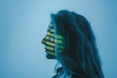 person with computer code printed on their face