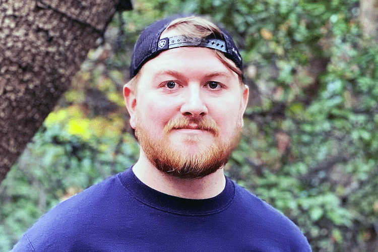 an informal outdoor portrait of Berkeley Law student Steven Hensley