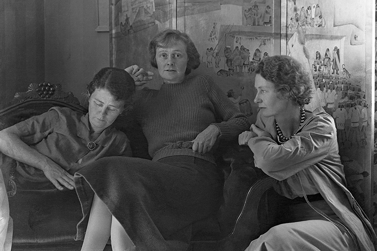 The Bruton sisters, from left Helen, Esther and Margaret, created one of the mosaic murals on UC Berkeley's Old Art Gallery buildings. This is a black and white 1930 photo of the sisters sitting close together. 