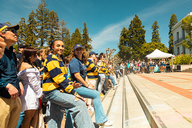 Cal Day attendees at Sproul Plaza look at the camera