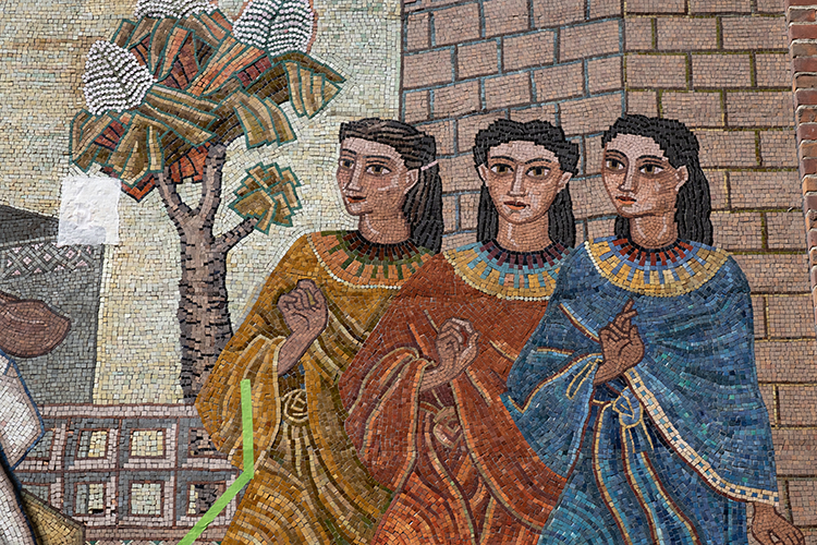 Three dancers in the colorful mosaic mural on the Old Art Gallery building.