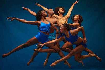 Several dancers in a mid-air formation