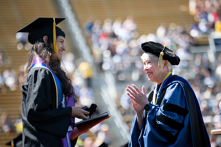 Catey Vera, Berkeley University Medalist, is presented her award at Saturday's commencement.