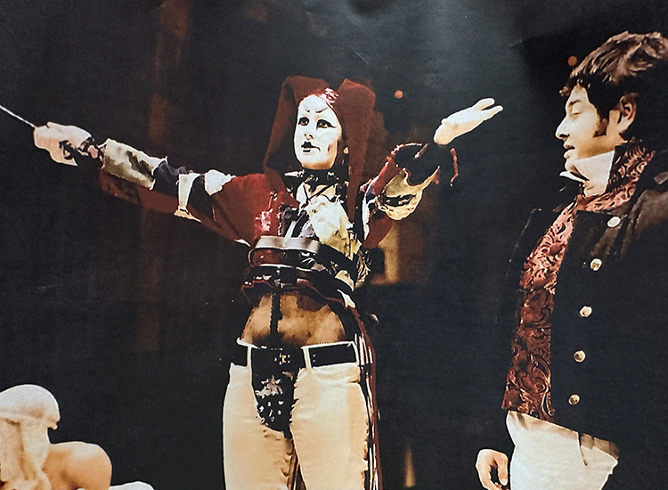 A photo of an actor wearing one of Sparks’ costumes onstage during a performance of Marat/Sade.