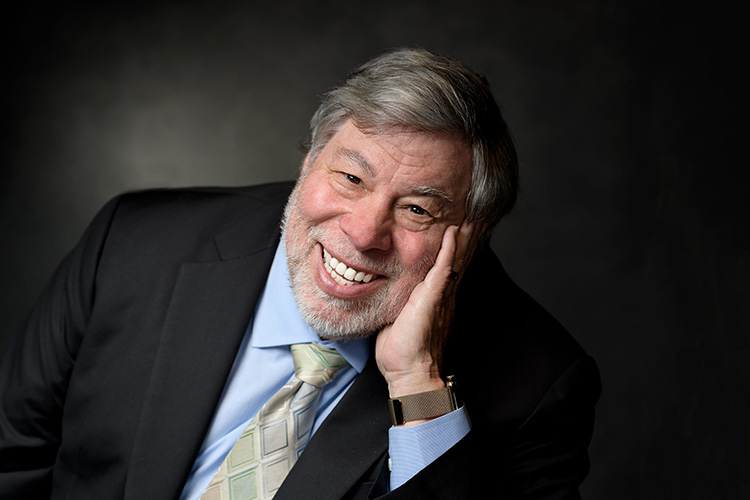 Steve Wozniak smiling in a suit