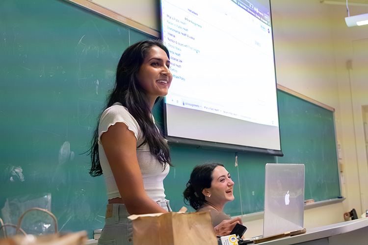 Ria Sood teaching a class for Public Health 116