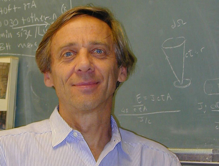 head shot of Don Backer with green board behind and chalked equations