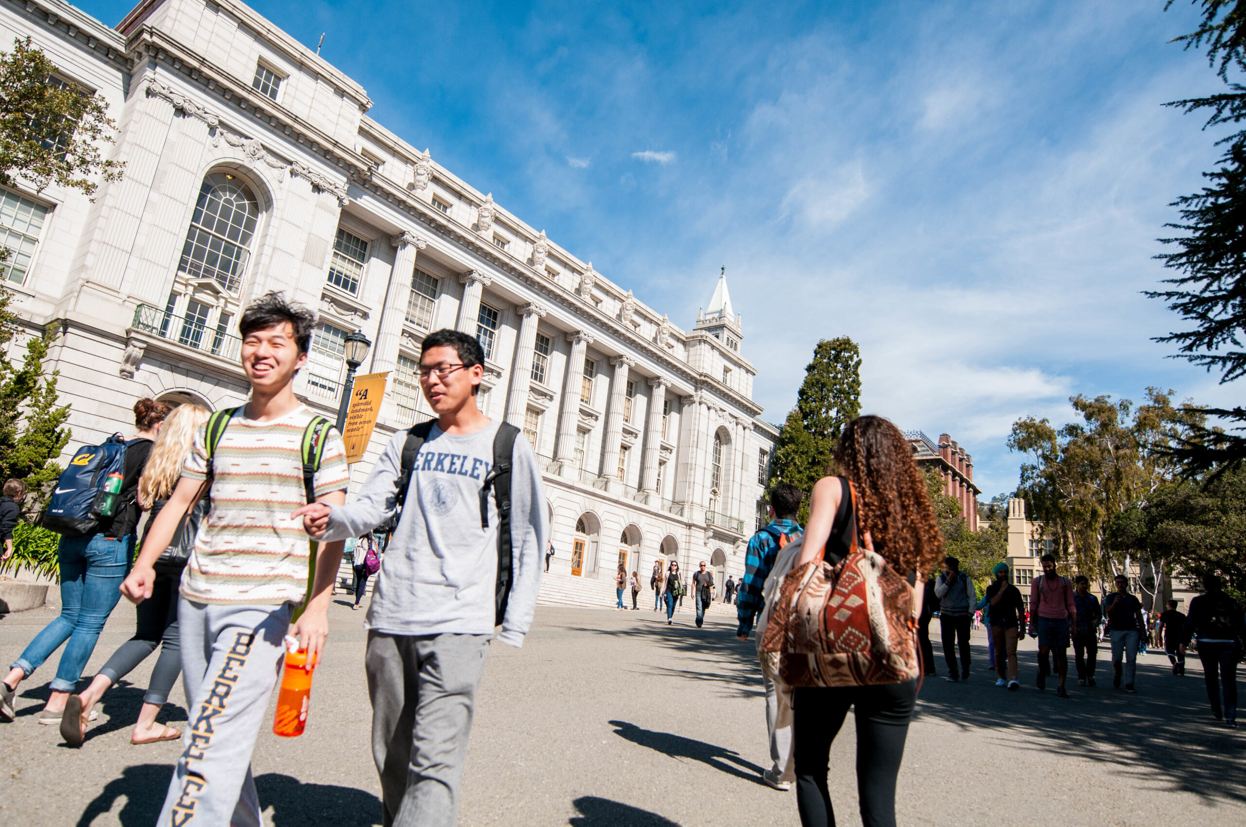 Students walk to and from class in front of Wheeler Hall.