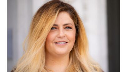 portrait of smiling woman with blond hair