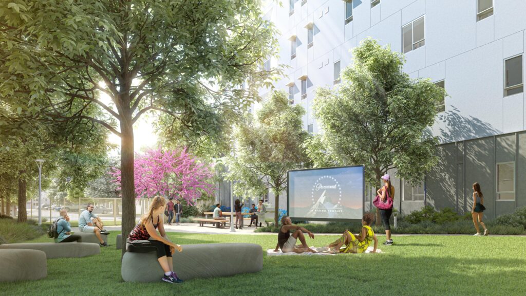 An artist's rendering of the new graduate student apartments in Albany shows grassy open space where students can relax and play under trees.