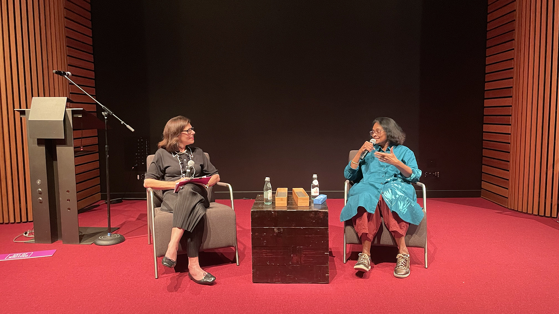 Sonali Deraniyagala and Ramona Naddaff talk on stage for a UC Berkeley event