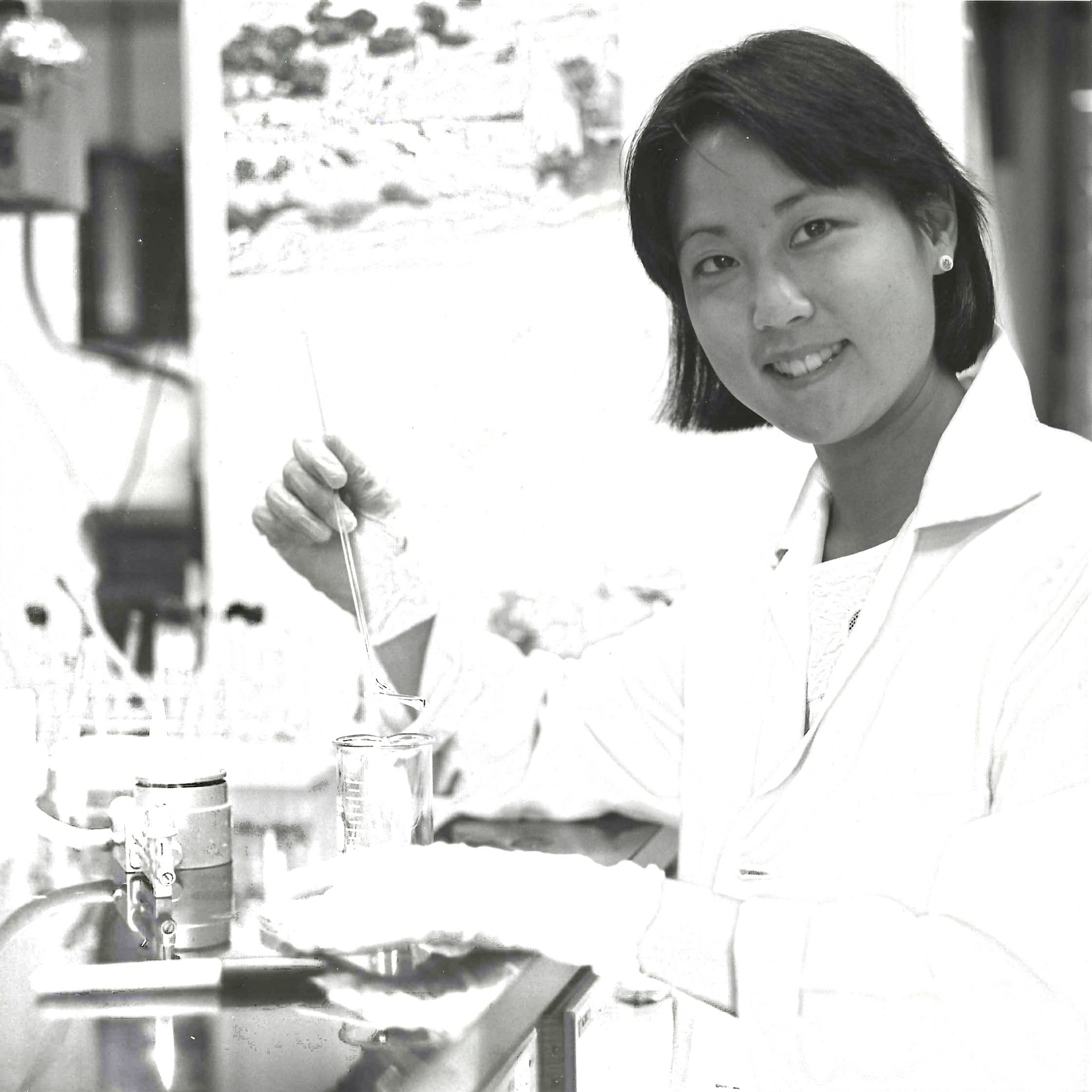 Carol Mimura as post doc at Berkeley doing an experiment in the lab.