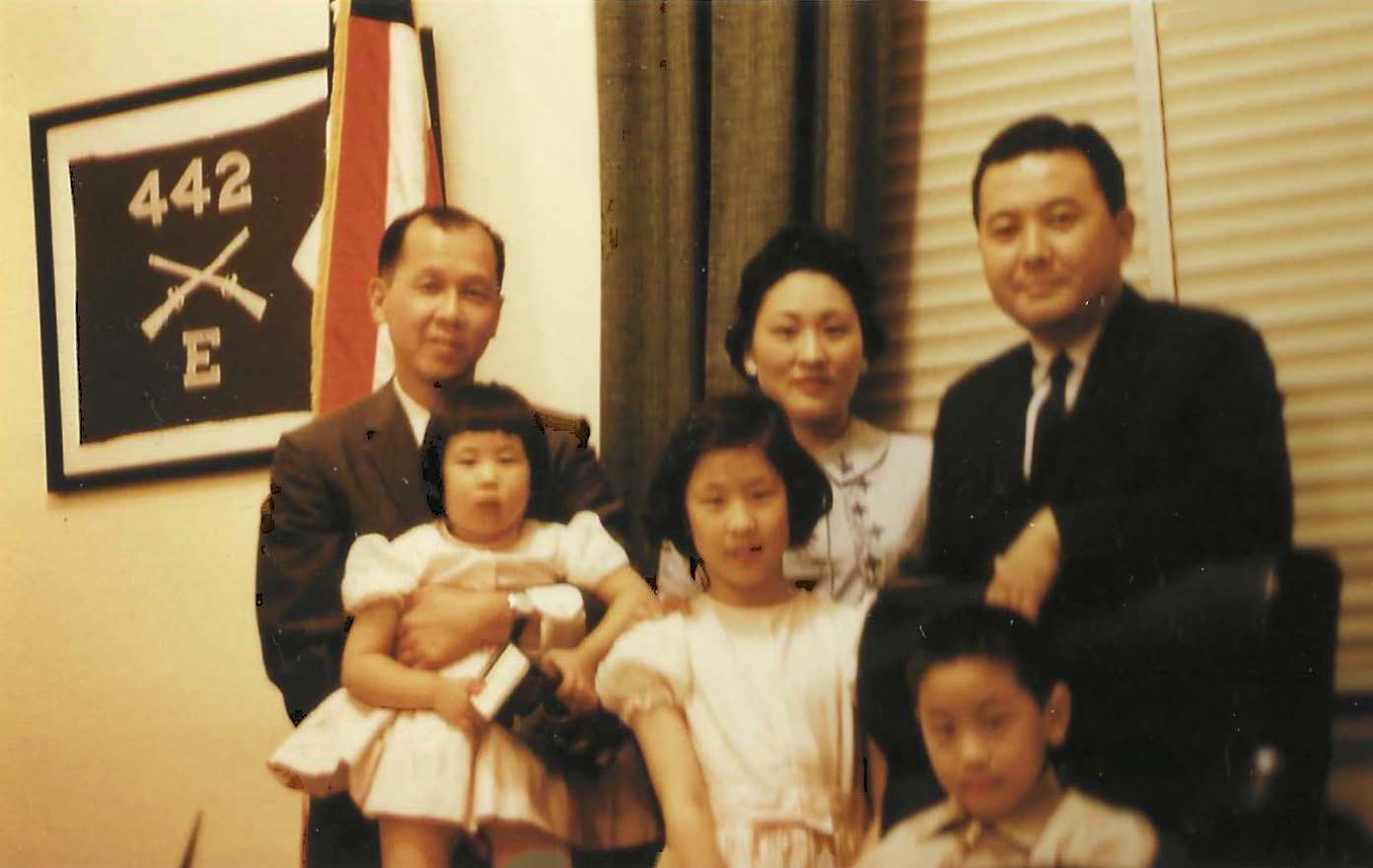 Carol as a child with her family and the late Sen. Daniel Inouye.