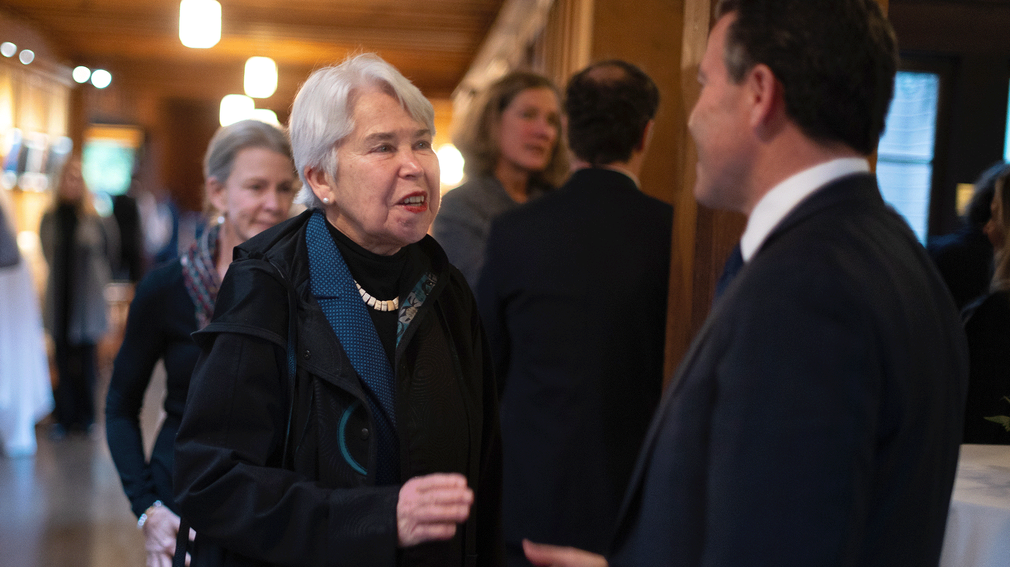 UC Berkeley Chancellor Carol T. Christ with a guest at the memorial service of former UC President David Pierpont Gardner