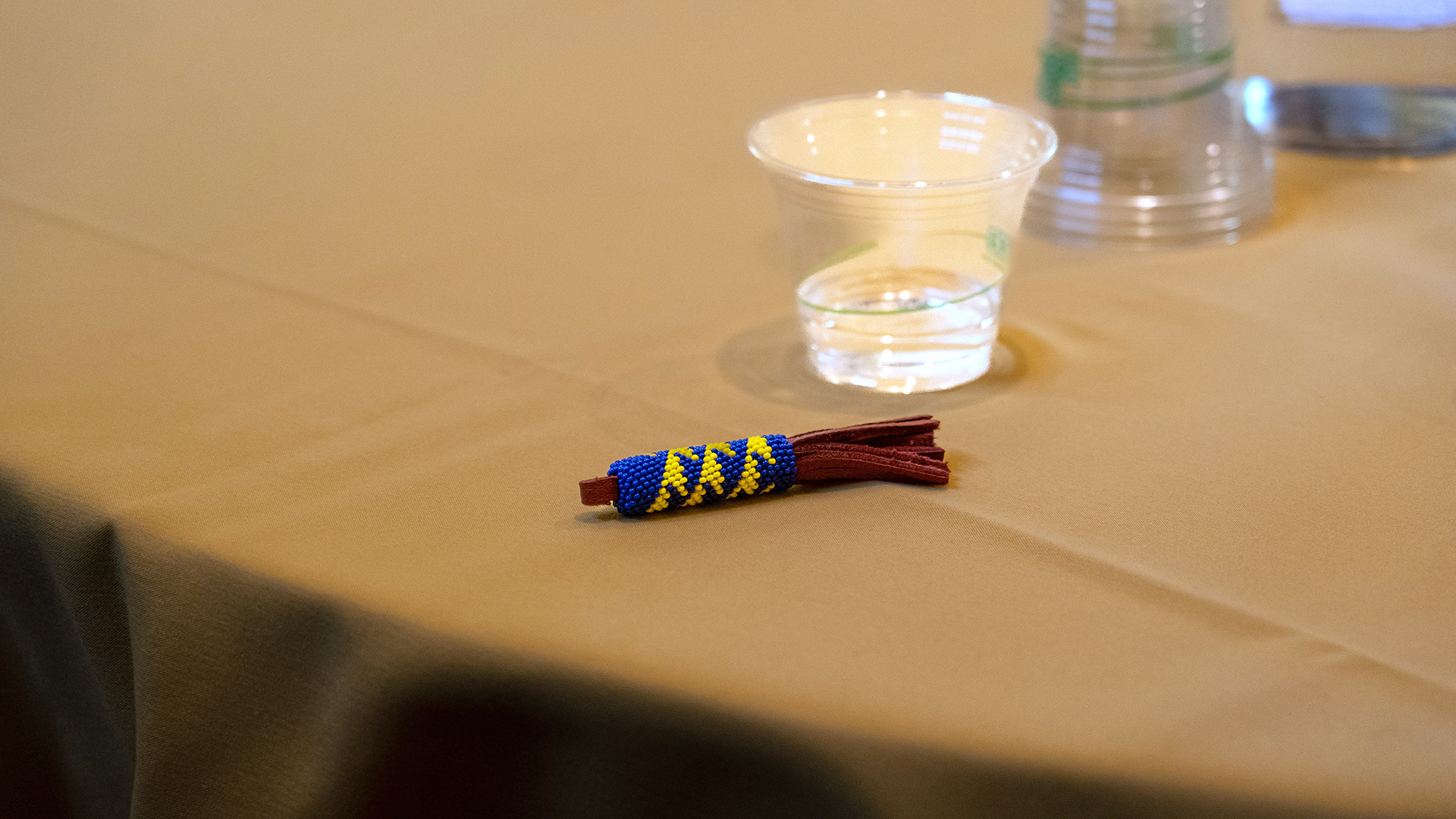 a beaded keychain sits on a table