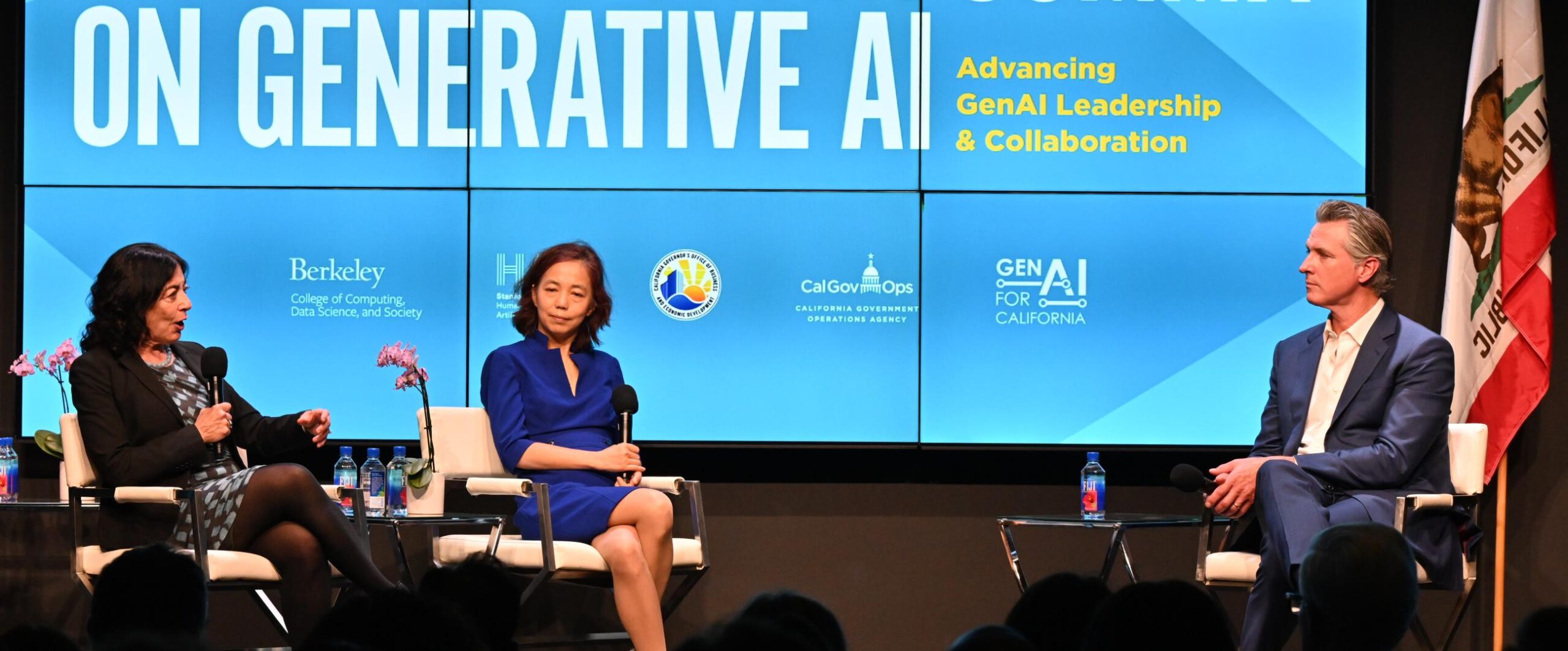 California Gov. Gavin Newsom speaks with UC Berkeley College of Computing, Data Science, and Society Jennifer Chayes and Stanford Institute for Human-Centered Artificial Intelligence Co-Director Fei-Fei Li about artificial intelligence on stage.