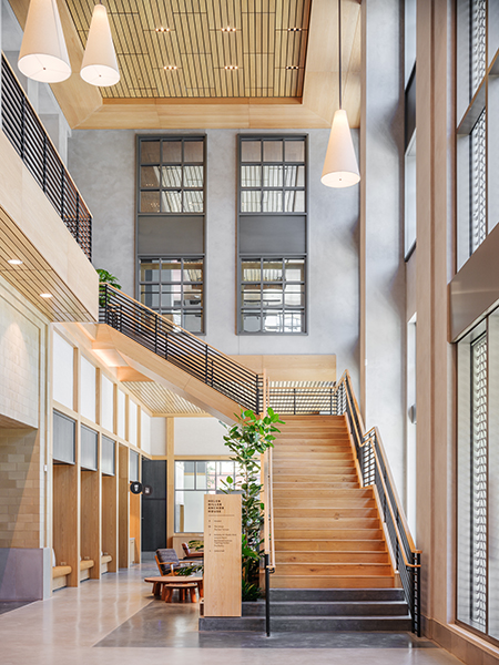 A large, tastful wooden stairway leads from the first floor of Anchor House, near its front entrance on Oxford Street, up to the building's second floor, where there are academic and community offerings including an art studio and a teaching kitchen.