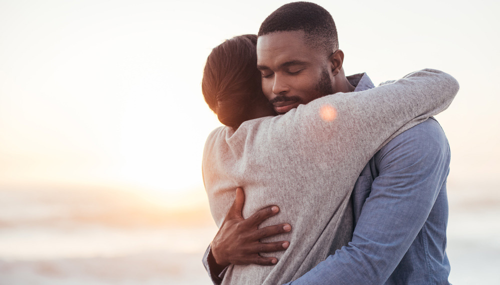 a man and woman hugging